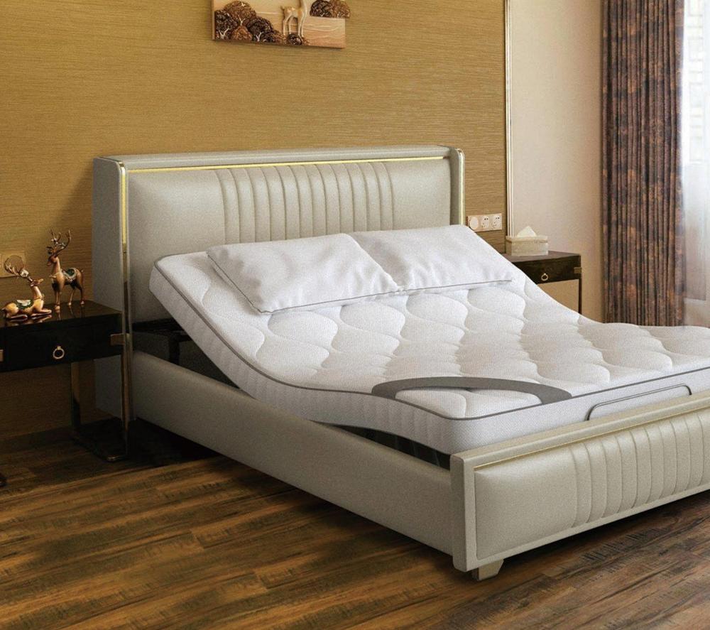 Champagne leather bed with a channel-stitched headboard and the head of the mattress raised