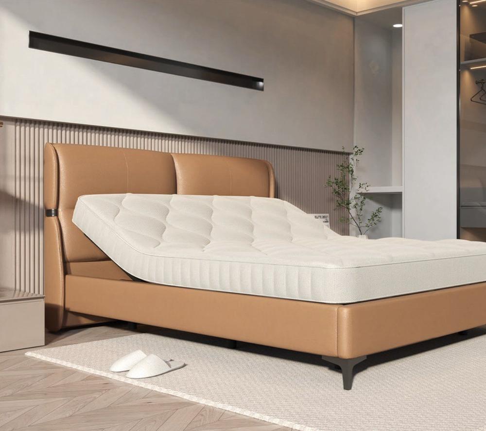 Tan leather bed with a built-in adjustable base, head section raised