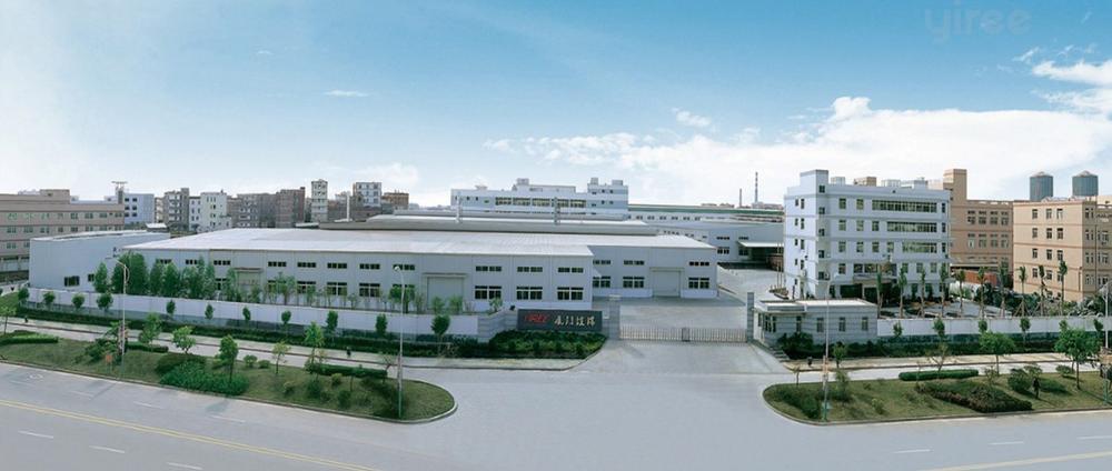 Yiree factory campus in Xiamen: long white production halls and an office block behind landscaped gates